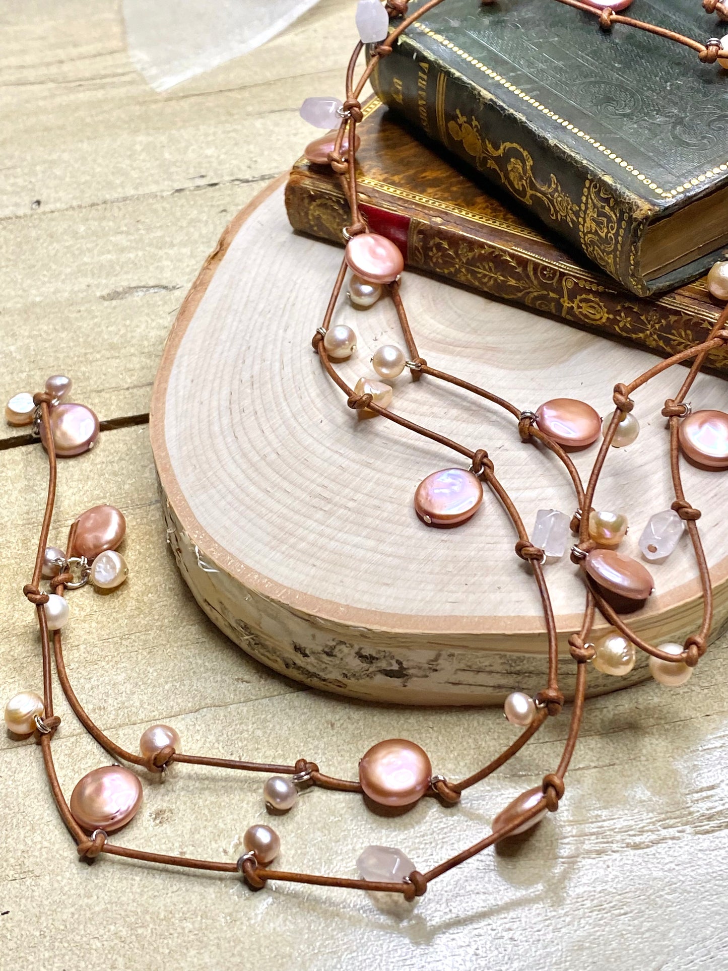 Stasha Soulstring of coin pearls and rose quartz on light brown lariat necklace