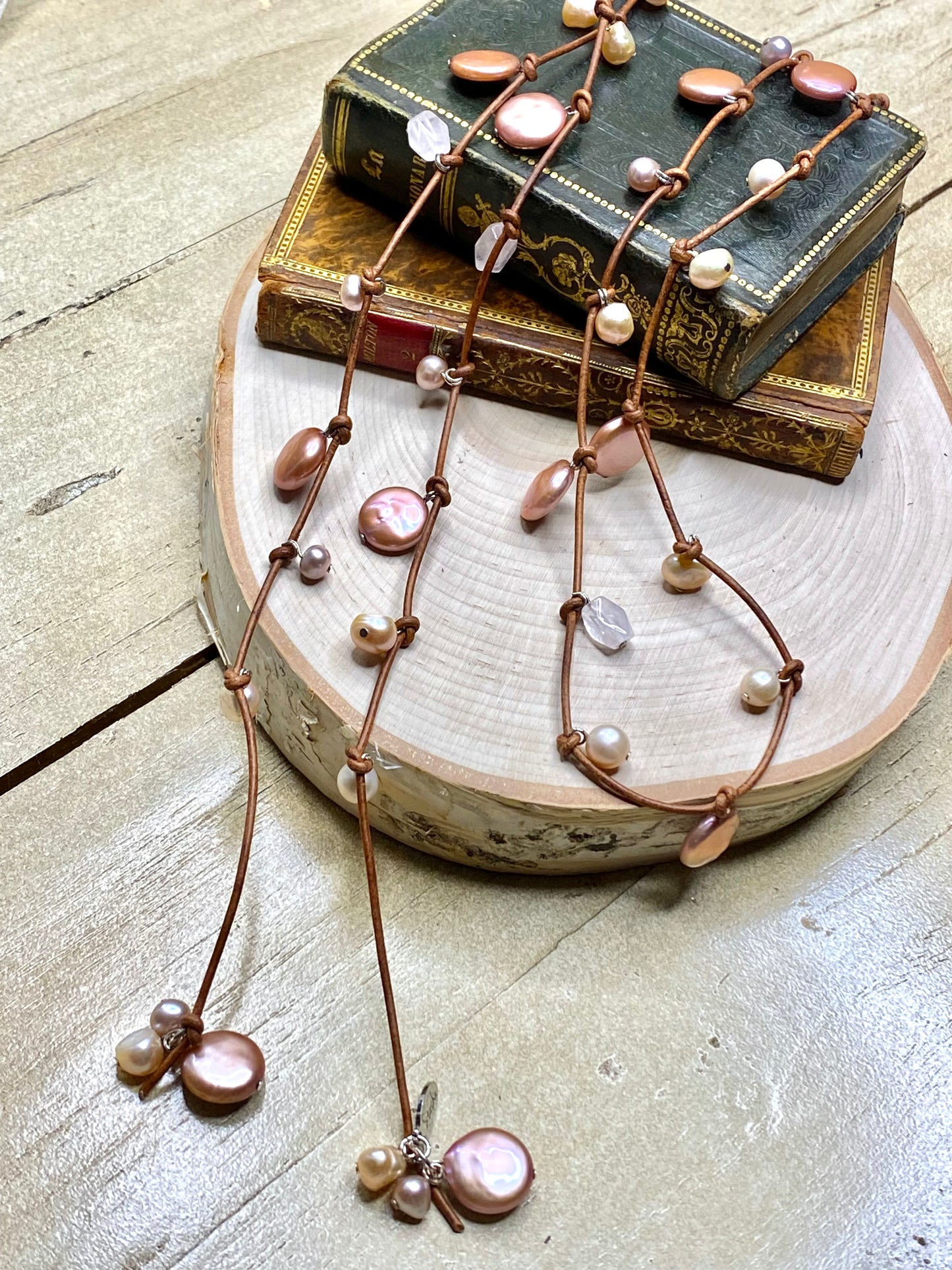 Stasha Soulstring of coin pearls and rose quartz on light brown lariat necklace