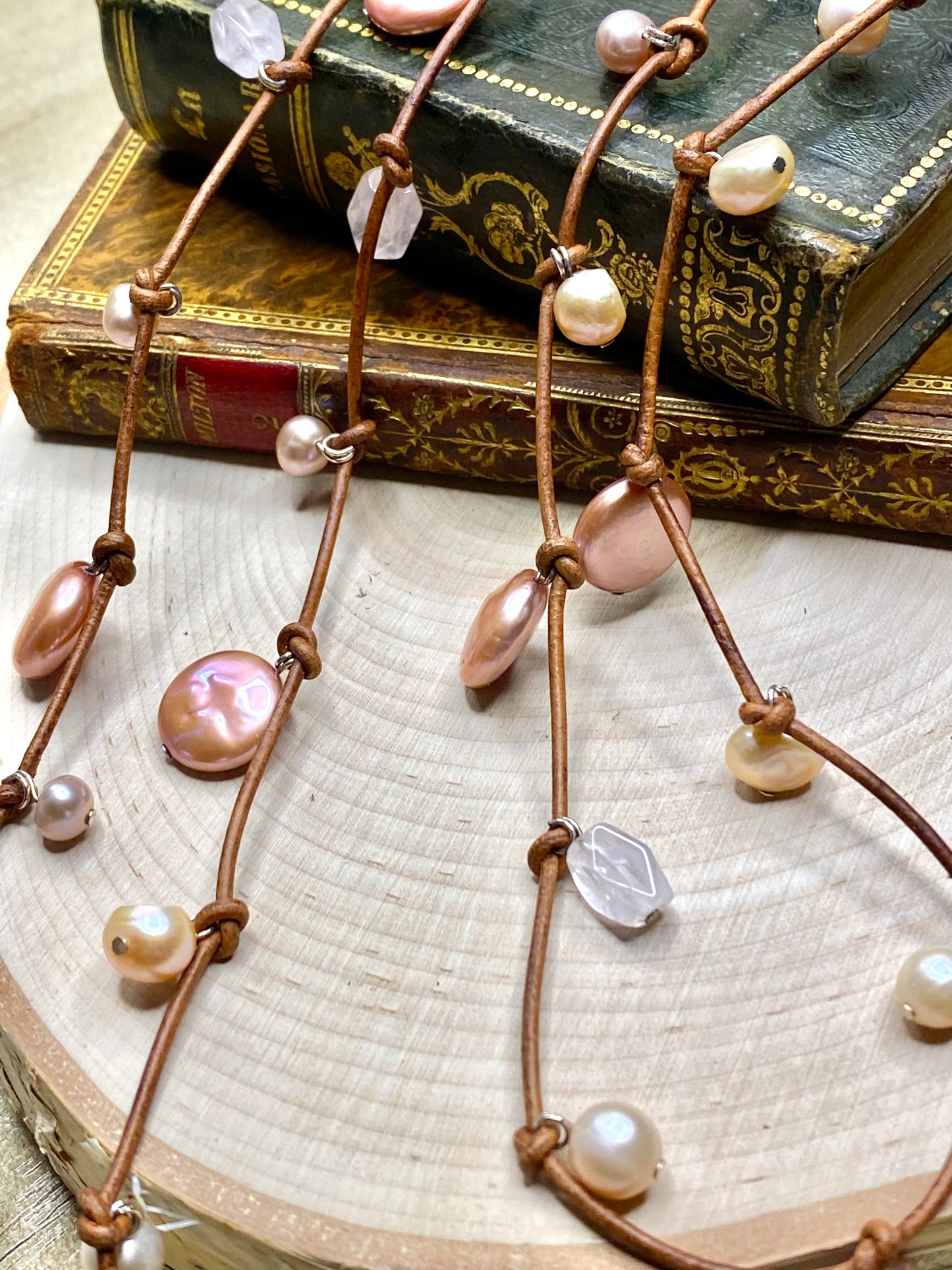 Stasha Soulstring of coin pearls and rose quartz on light brown lariat necklace
