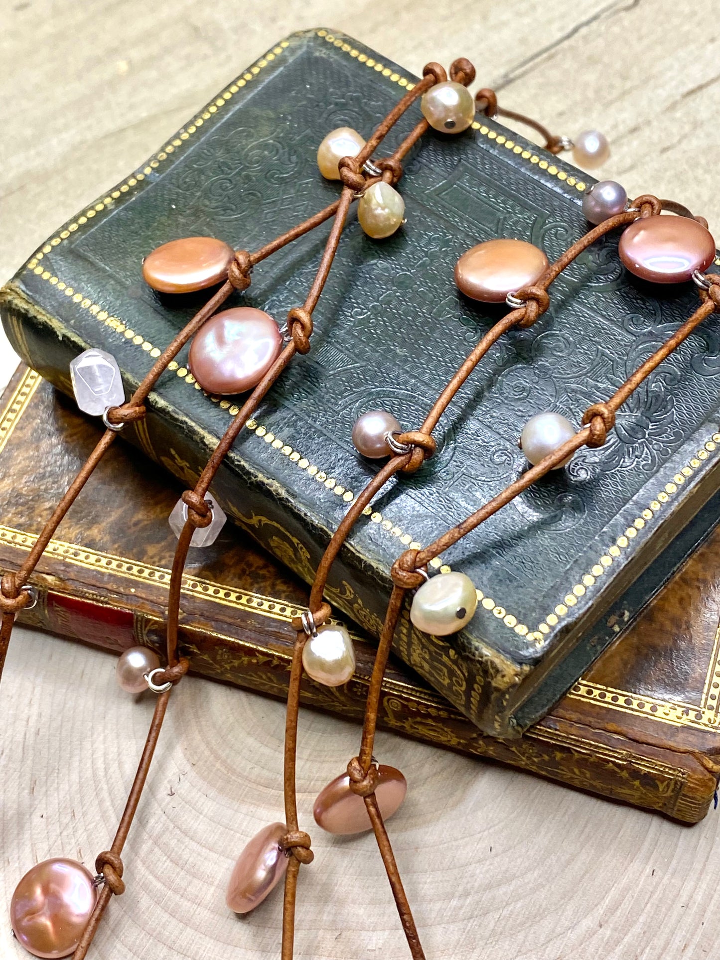 Stasha Soulstring of coin pearls and rose quartz on light brown lariat necklace
