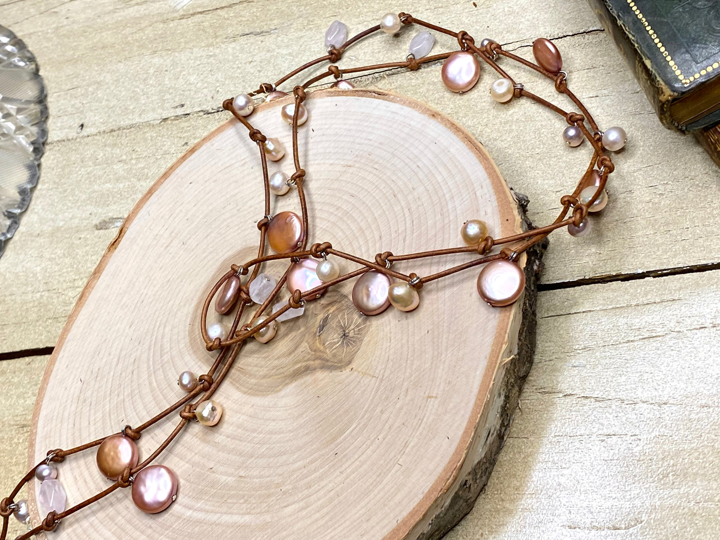Stasha Soulstring of coin pearls and rose quartz on light brown lariat necklace